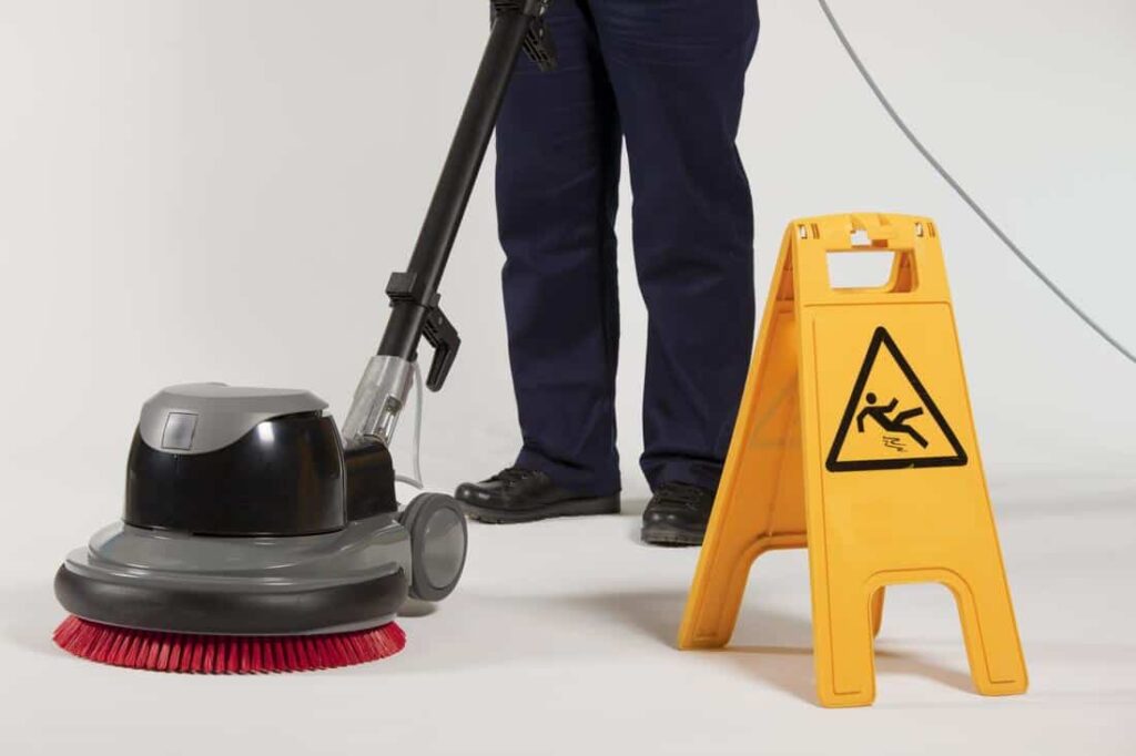 man vacuum cleaning a floor