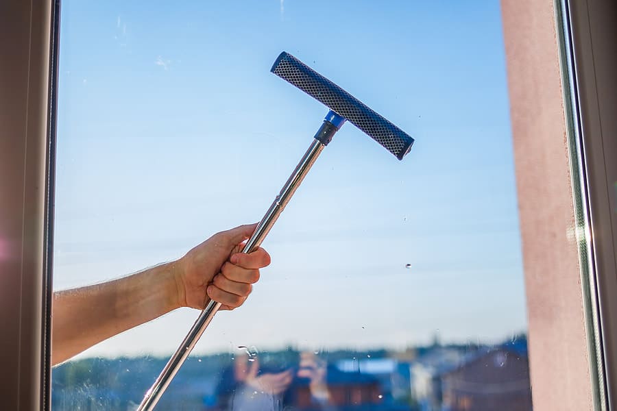 man cleaning windows